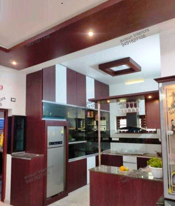 Modular kitchen design with built-in appliances and under-cabinet lighting